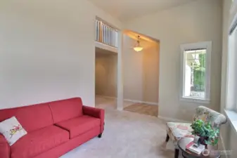 Looking from the living room back to the entry - fresh interior paint and new carpeting makes this home move in ready!