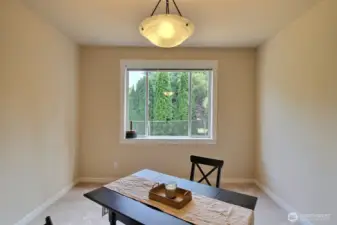 Formal dining room is located off the kitchen, in a quiet area of the home. This room is spacious enough for a big table for those large celebrations and gatherings. Huge picture window looking out to the backyard.