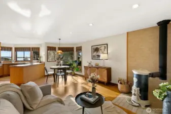 Open kitchen w/ Sound views, casual dining area & den