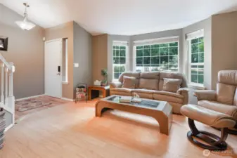 Formal living room with a bay window.