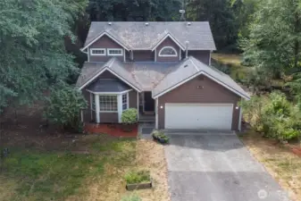 Tucked off the street, the long driveway provides ample space for parking.