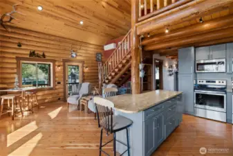 Staircase leading to the loft, functional yet a piece of art that adds to the great room.