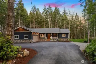 Centrally located for shopping in Port Orchard or Costco in Gig Harbor, Quick access to Highway 16 and 15 minutes to the Tacoma Narrows Bridge. Enjoy summer swimming and fishing on Opening Day at Horseshoe Lake.  Upgraded materials used in building this custom home ~ Stacked Stone Accents, Hardi-Cement Siding, Cedar Shingles, Pine Tongue and Groove soffits with lighting, and leaf guard gutters. Hot/Cold Water on the exterior on main and lower levels! The expansive garage boast 594 SQ FT...completely insulated and 100% finished. Lighting and some security camera's are included.  3,808 Sq Ft; 4 BEDROOMS, 2.5 Baths, Laundry Rooms on both levels Plus an Office.