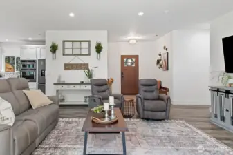 Inviting Entry opens to the Great Room and has a sitting bench for ease of removing and putting shoes on/off.  Wall mounted big screen is located so people can watch the football games from each area