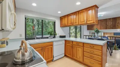 Expansive counter space offers easy serving options and overlooks the secondary dining space.