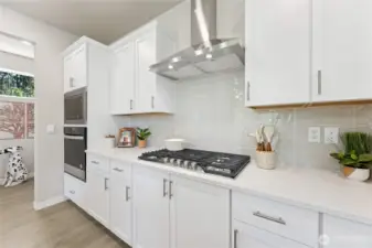 Photos are for representation purposes only. Colors and options may vary. Gas 5 burner cooktop with extraction hood vent!
