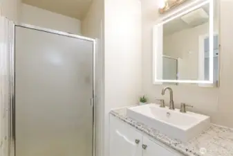 Primary bathroom with three-quarter bath.