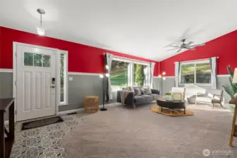 Living Room with large vibrant windows and vaulted ceilings