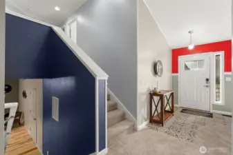 Front Entry way with stairs up to bedrooms or down to flex room, utility room, and garage