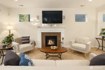 The great room is cozy with a gas fireplace, surround sound, and the tv is included.