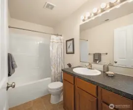Second full bathroom on upper floor with tub/shower combination.