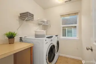 Upstairs laundry room with folding area. Washer and dryer are included!
