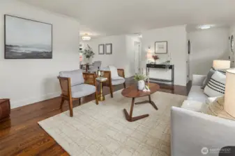 Living area flowing seamlessly into dining room.