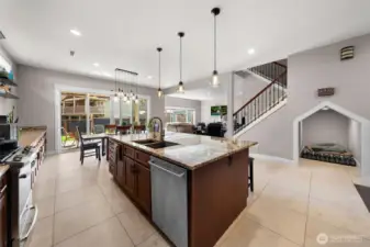Beautiful Stainless appliances, and a nook for furry friends under the stairs.