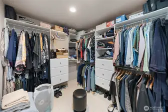 Large walk-in closet with extensive hanging space and built-in organization.
