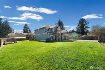 Expansive backyard with open lawn and room to enjoy the outdoor setting.