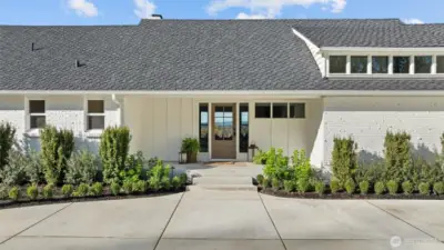 50-year Presidential roof, new windows, solid wood door and custom board and batten detail.
