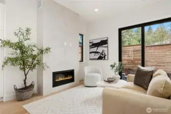 Cozy Living Room with Gas Fireplace with Floor to Ceiling Surround