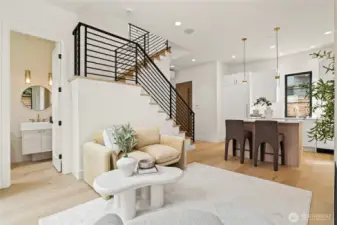 Open Staircase with Hardwood Floors and Custom Metal Railings