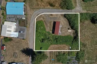 Lot lines are estimated. This lot has two levels, the western boundary line is on the upper level of the lot.  It is ok to walk on this part of the lot, seller owns the adjacent lot the adjacent lot's tenant is ok with potential buyers walking near the gardens.