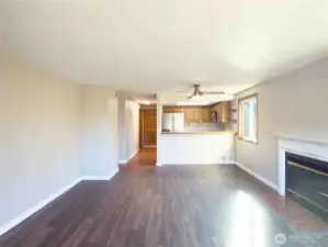 This living room is open and extending to the sunny back patio