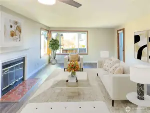 This living room is open and extending to the sunny back patio