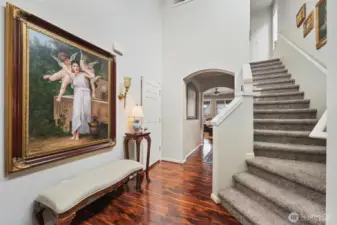 Garage entryway to the left, Downstairs 1/2 bath behind the photographer