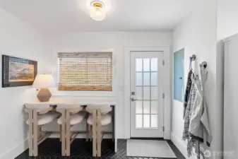 Eating , or work space. Beautiful door leads out to the deck.