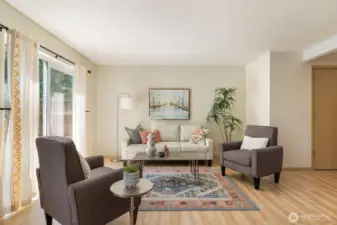 The spacious living room provides easy access to the backyard.