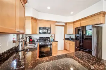 Plenty of space in this kitchen and gorgeous granite countertops.
