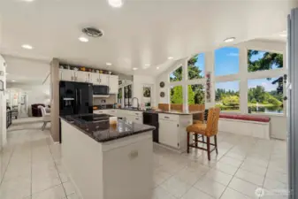 The final expansion enlarged this kitchen with a vaulted ceiling wall of windows.  This last conversion completed the home's 2867sf size.  Enjoy the abundant cabinet and counter space.