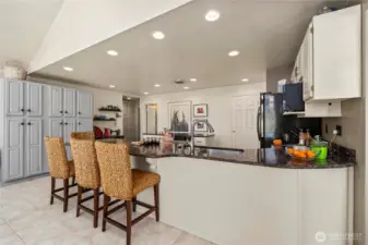 Notice the well thought out wall of storage cabinets that were added in this kitchen as well.