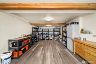This 12'x24' shop was added with the second large renovation the garage is above this fully finished shop space.  Combined you have 576sf of garage and shop.