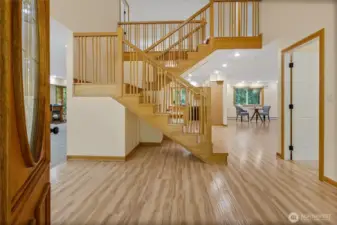 Soaring ceilings and open-concept living greet you at the door.