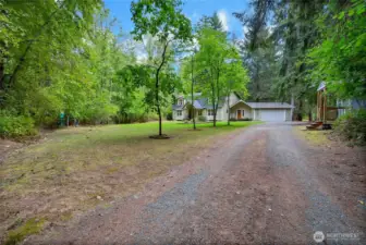 A secluded driveway leads you to this 3,460sf home tucked into nature.