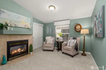 Cozy room with double sided fireplace — perfect for reading, relaxing, or guests.