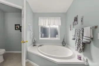 Relax and unwind in the large corner soaking tub.