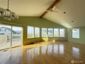 Huge living room/dining area with wall of windows showcasing the incredible ocean views