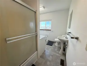 Full bath with laundry and 2nd sink  and access to back