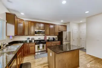 Gleaming granite countertops and stainless appliances make a timeless and beautiful kitchen
