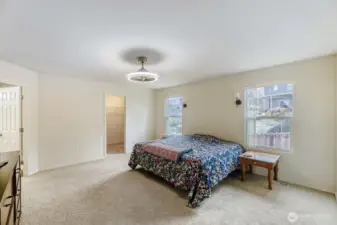 Giant primary bedroom with walk-in closet and ensuite bath