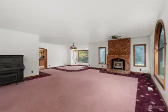 Huge great room with propane fireplace and bay window.