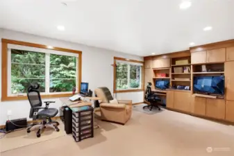 Incredible home office/den with built in cabinetry and room for multiple work spaces or even add a Murphy bed for guests