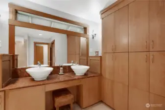 Custom built ins in the primary bath with double sinks at the vanity