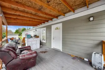 Large covered front porch with trex deck for low maintenance living. Stunning view of Mt. Baker from here.