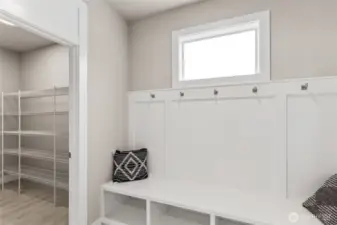 Built-in Shoe Drop & massive walk-in pantry are located as you enter from 3-Car Garage. Photos are for representational purposes only.  Colors and options may vary.