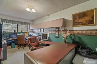 Flex room downstairs currently being used as a double office, has been used in the past as a guest room, craft room, play room, man cave. Large closet (on right) gives added storage.