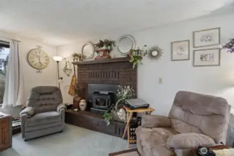 This fireplace with wood-burning stove insert can keep the upstairs warm and cozy on a long dark Winter's day!