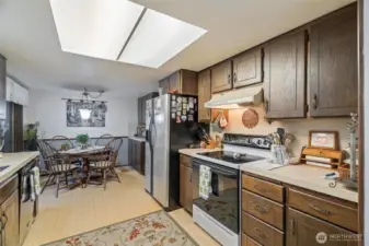 This bright, tidy kitchen is perfectly laid out for all your kitchen needs with extra storage in breakfast nook.