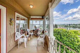 The inviting covered porch offers a view of the Port Washington Narrows, the Manette Bridge & the Olympic Mountains!